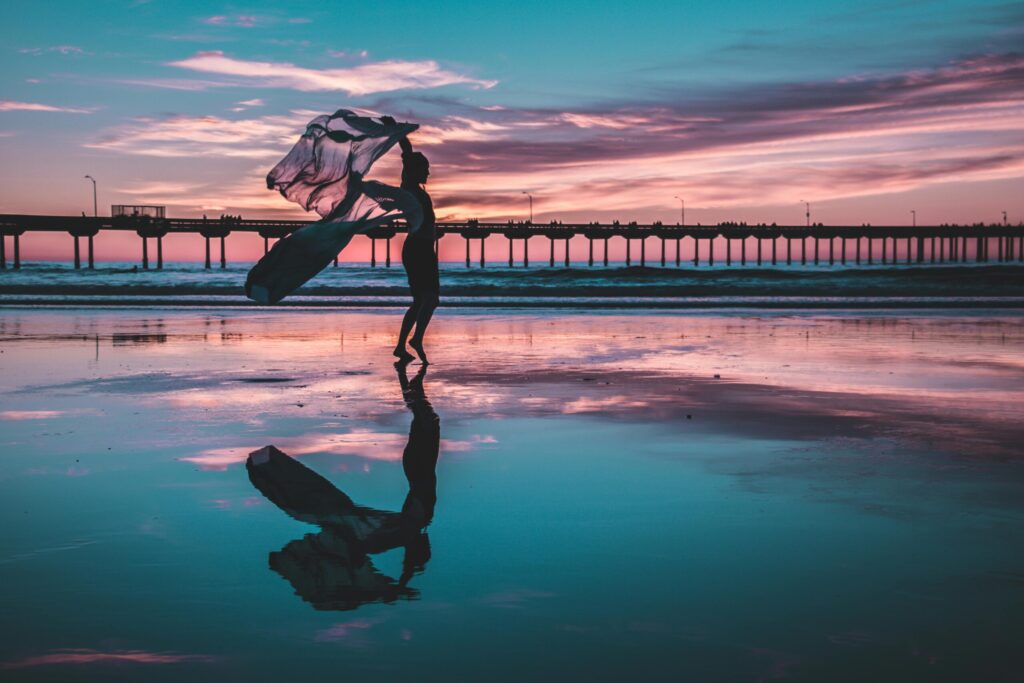 Woman standing on shallow water